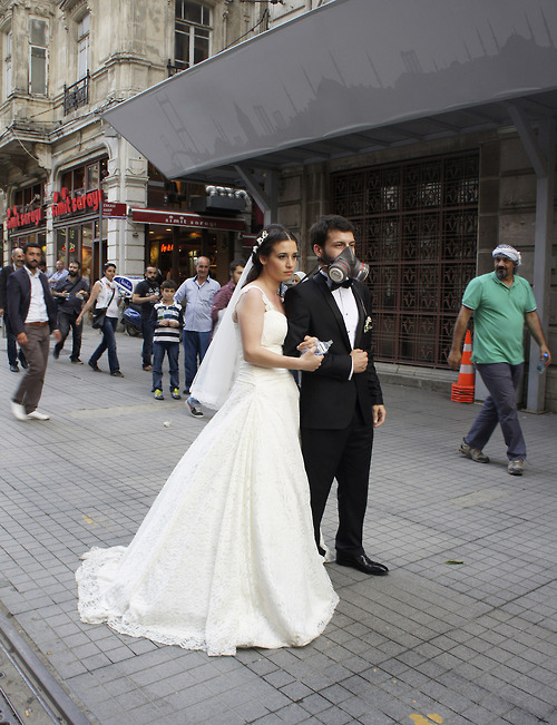 A newly married couple pose for their wedding picture at Istiklal street near Taksim square in Istanbul